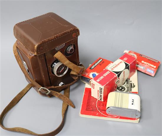 A Rolleiflex 3.5 TLR camera with Carl Zeiss Tessar 1:3.5 f=75mm lens and accessories